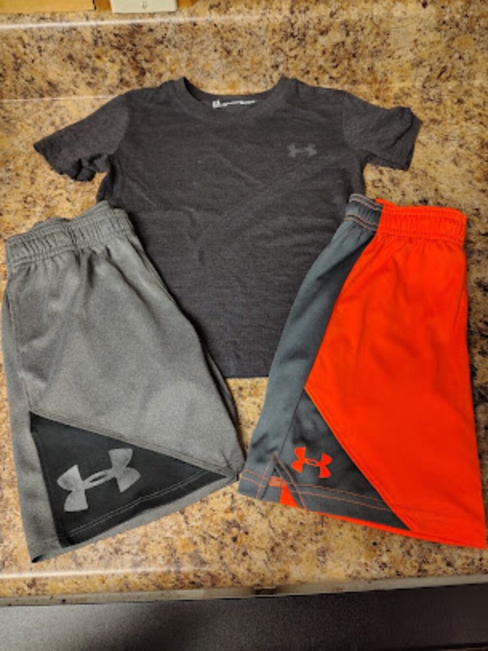 Under Armour shirt and 2 pair of shorts